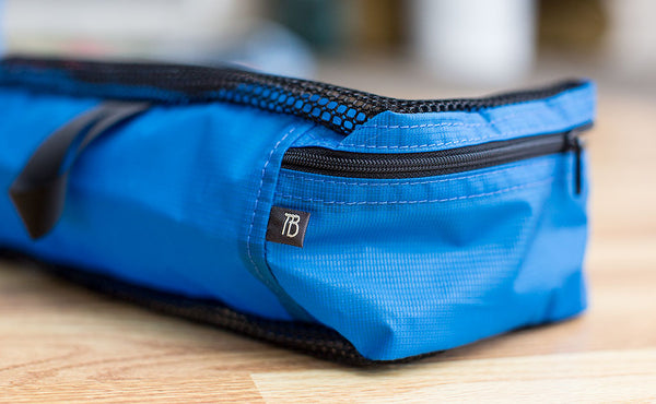 Each Small Packing Cube has a small black and white TB tab below the zipper.